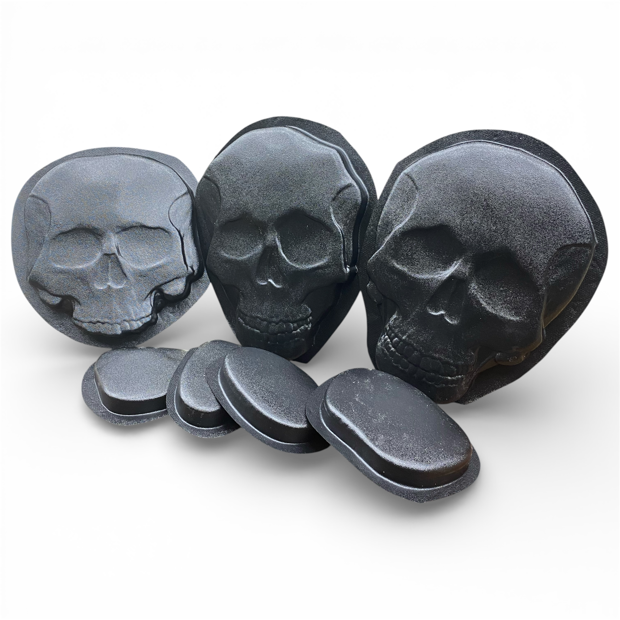 Black skull-shaped objects on a white background