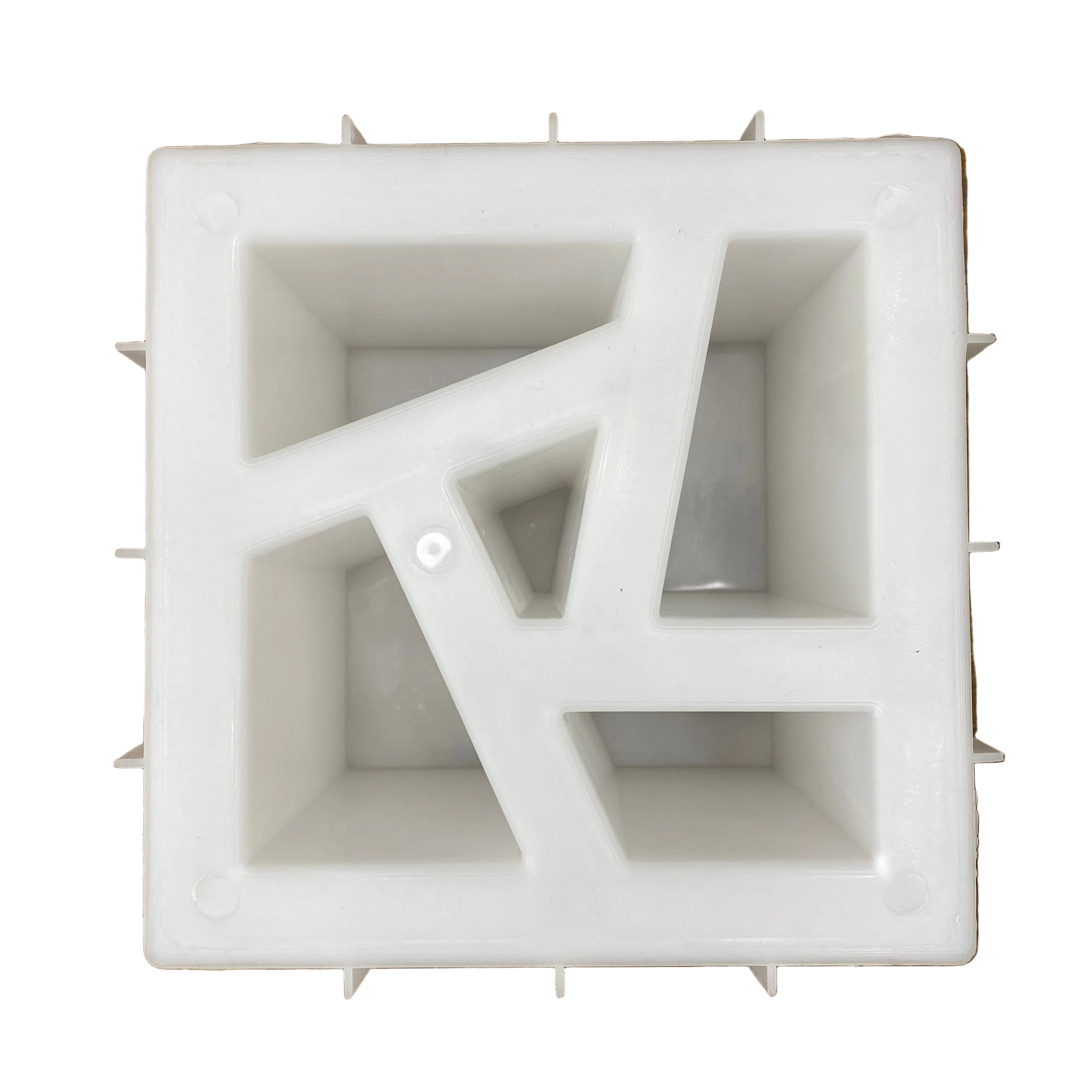 Shattered pin breeze block mold by Pacific Mold Design showing cast concrete block with bold fractured expressive broken geometric pattern for artistic statement decorative walls