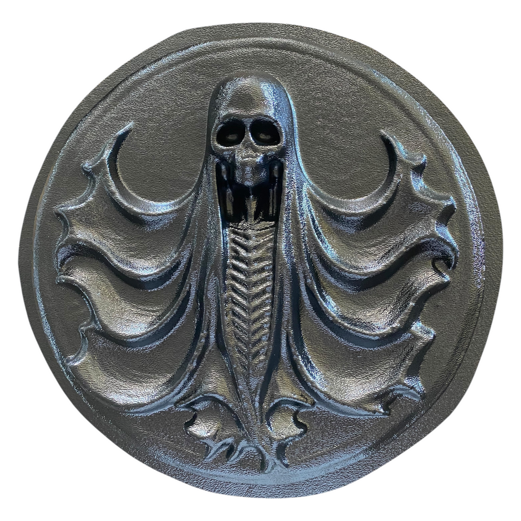 12-inch Grim Reaper plaque ABS mold by Pacific Mold Design showing circular gothic reaper scene in black plastic designed for concrete and plaster wall art casting