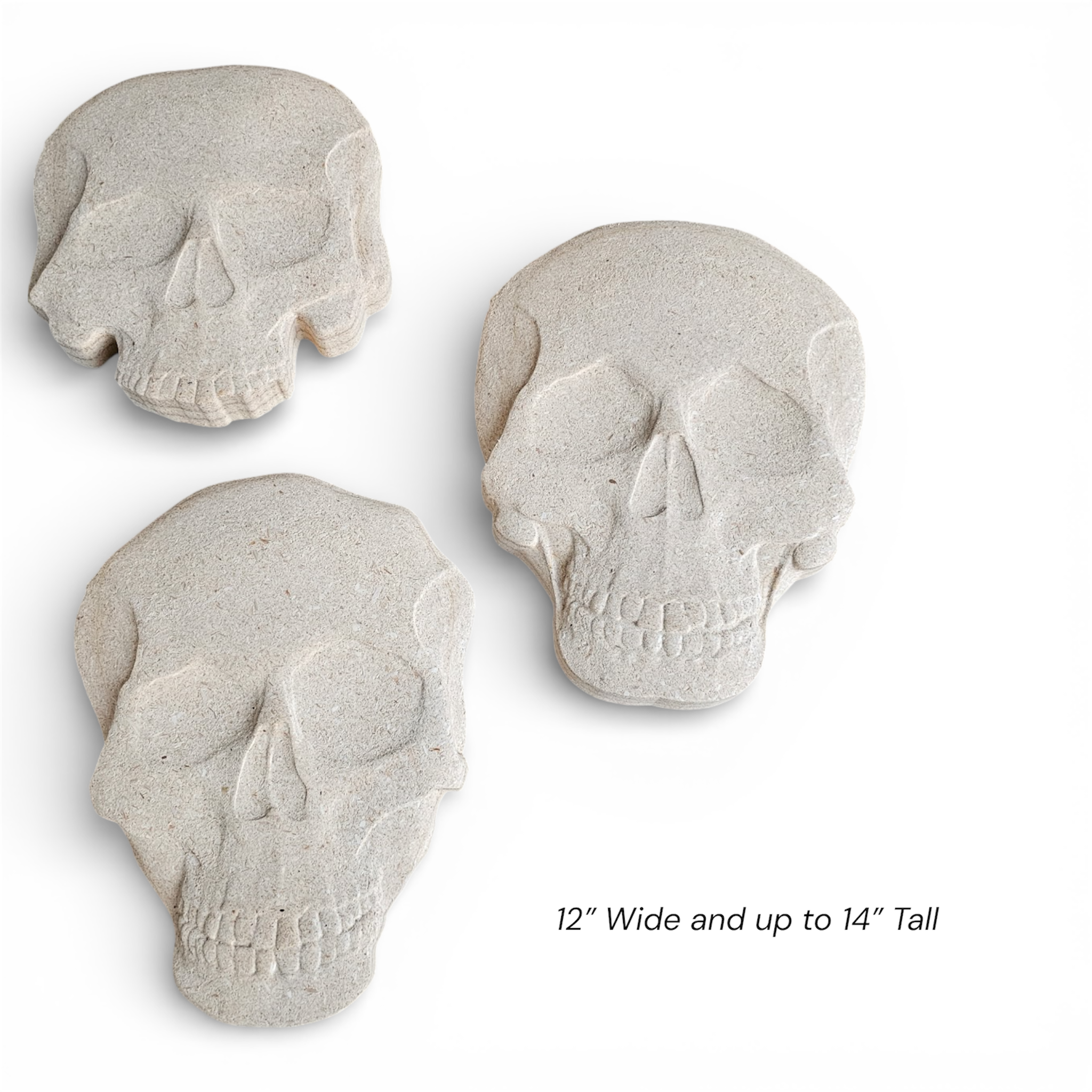 7-piece skull stepping stone mold set by Pacific Mold Design showing assorted skull-shaped ABS molds arranged on stone path background