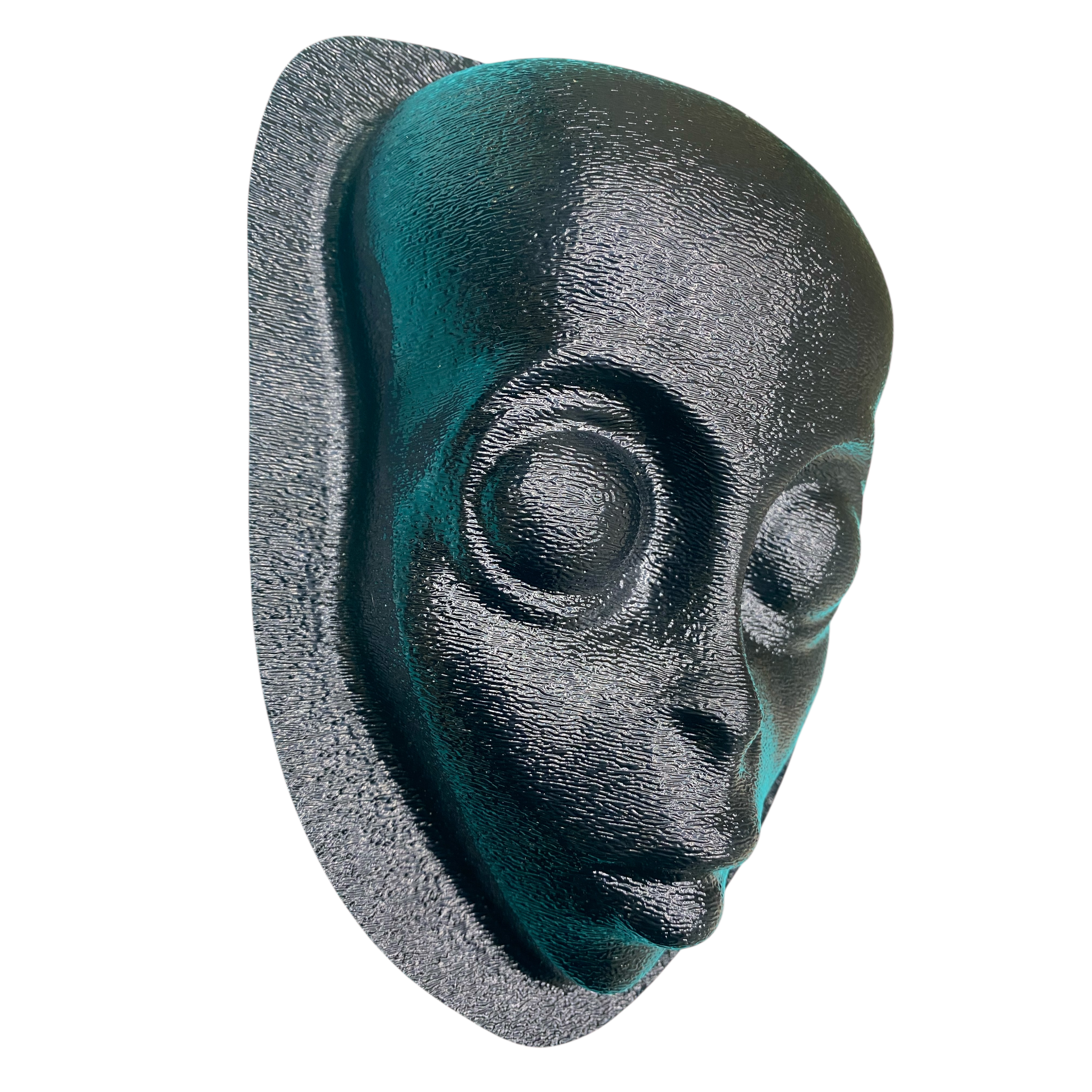Black and green alien head sculpture on a white background