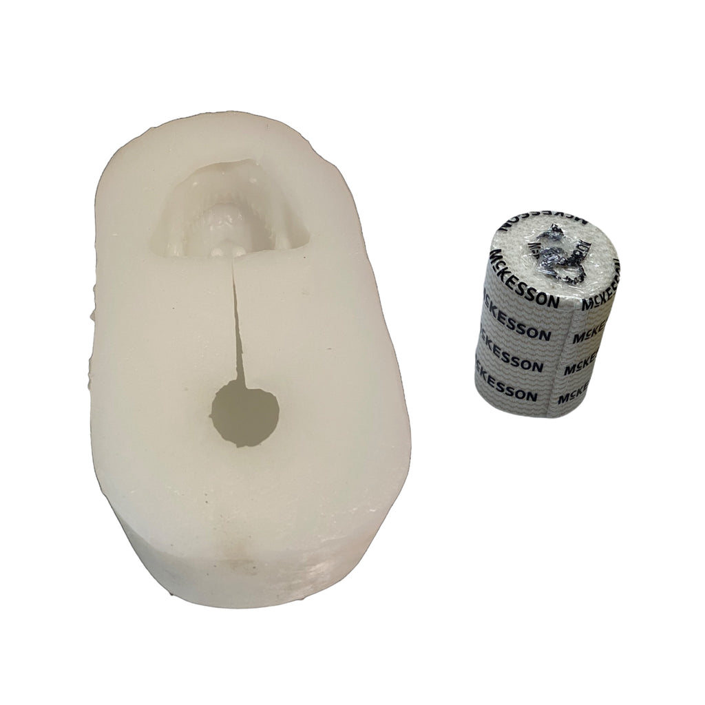Full-scale human skull silicone mold by Pacific Mold Design shown in beige flexible silicone capturing complete skull anatomy including mandible at life-size 6.5 inches tall