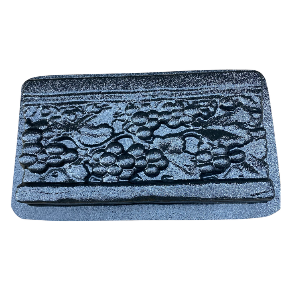 12-inch vineyard deco ABS mold by Pacific Mold Design showing grape vine and leaf pattern decorative strip mold for casting concrete backsplash accents and countertop border tiles