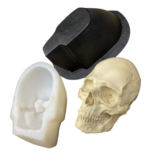 Flat back silicone skull mold by Pacific Mold Design showing two-piece mold with black ABS outer support shell and white silicone inner liner for wall-mountable skull casting