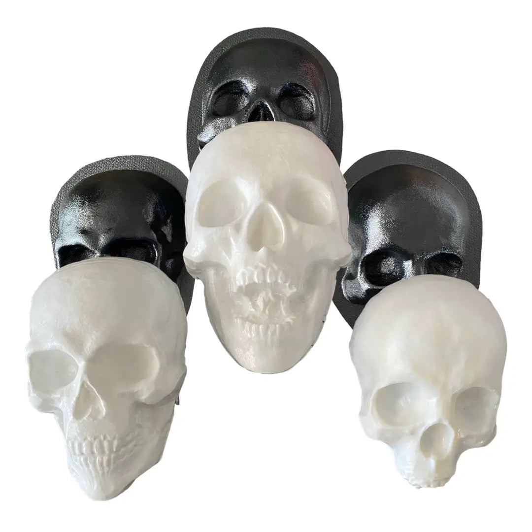 Ultimate haunt mold bundle by Pacific Mold Design showing collection of ABS skull molds, femur bone molds, and face molds with NEW Haunt Bundle label displayed on white background