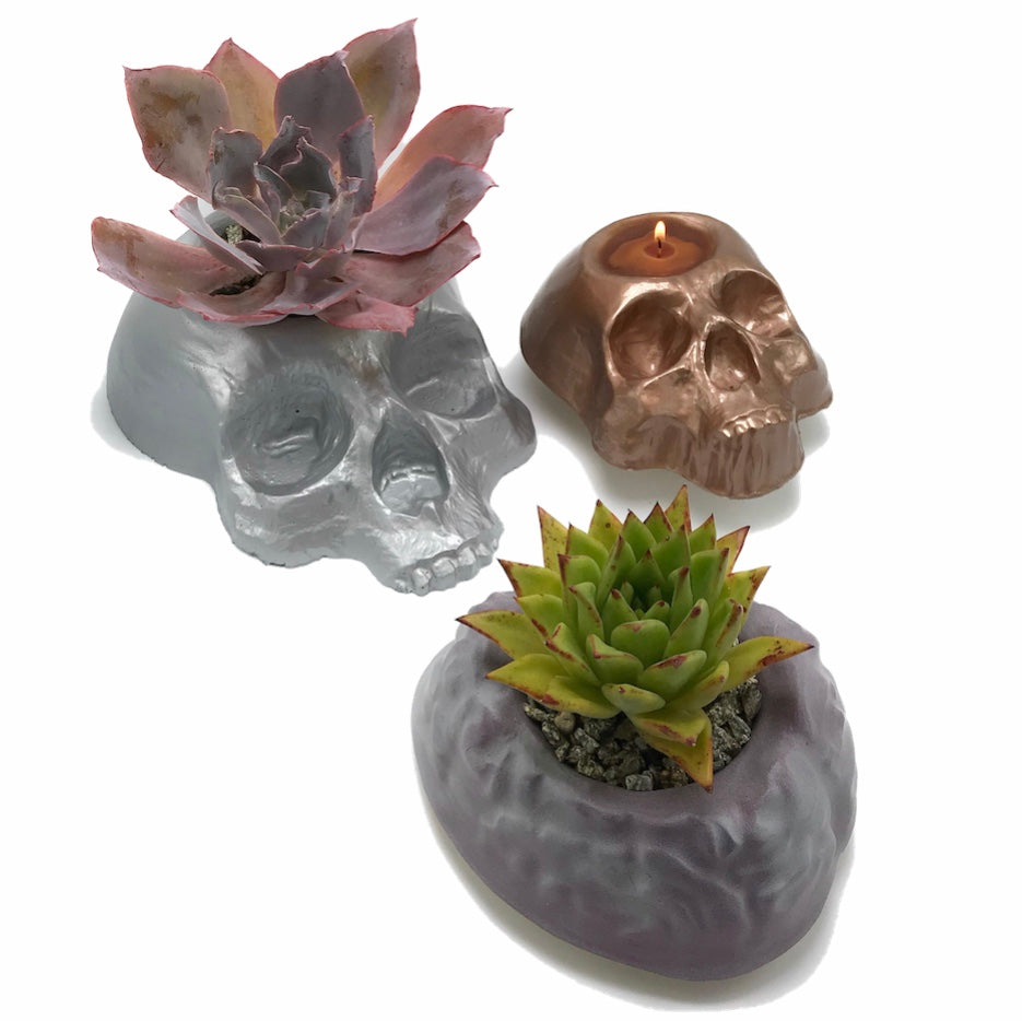 3-piece macabre planter mold set by Pacific Mold Design showing one 8-inch skull planter mold, one large skull planter mold, and one brain planter mold for concrete and plaster casting