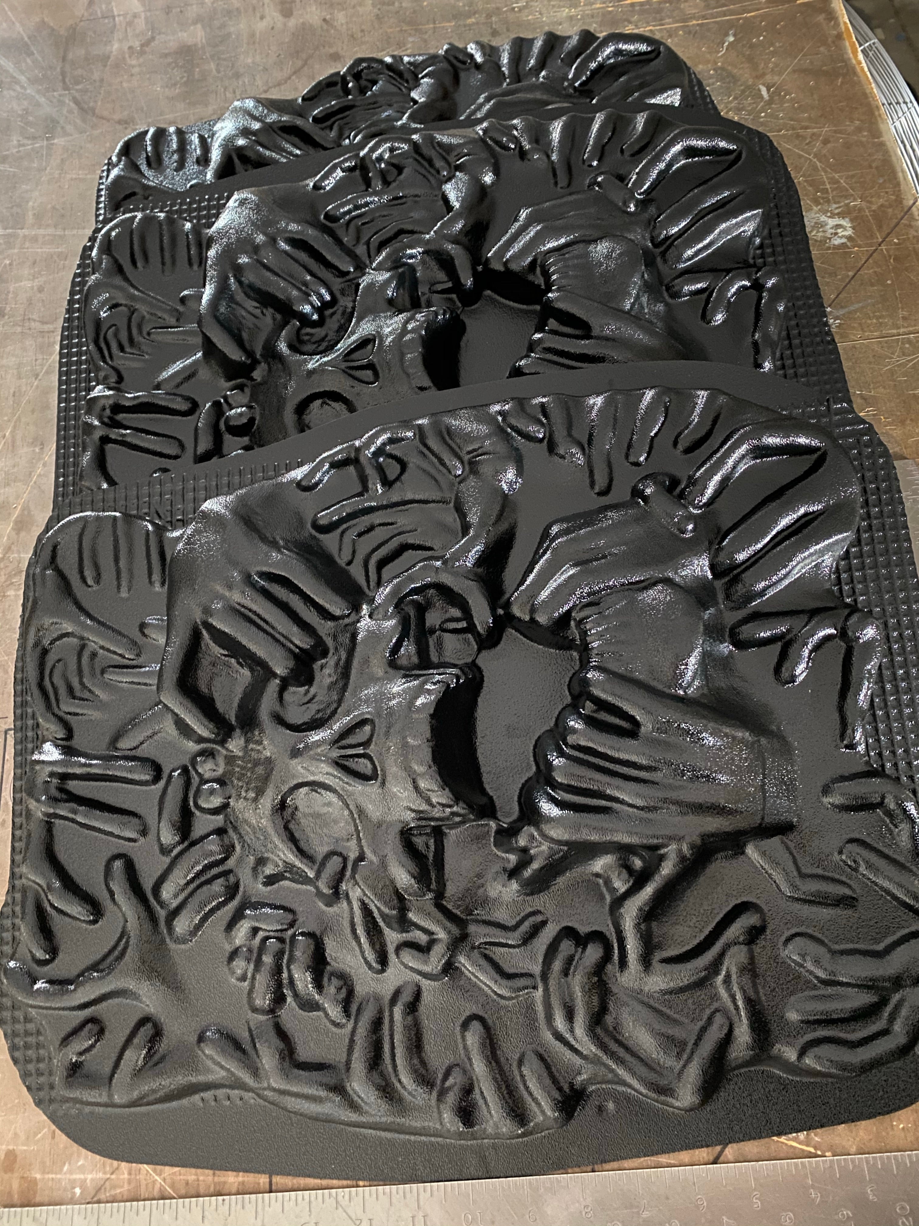 17-inch ripped skull ABS mold by Pacific Mold Design showing large plastic mold of skull being torn apart by hands on each side designed for concrete or plaster casting