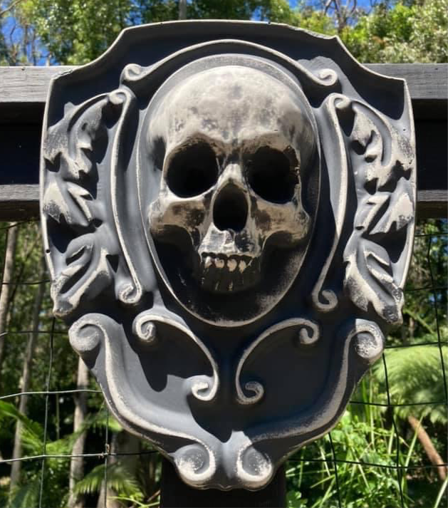 16-inch skull crest ABS mold by Pacific Mold Design showing gothic shield-style mold with skull centerpiece design measuring 16 by 14 inches for concrete and plaster casting