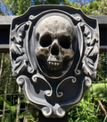 16-inch skull crest ABS mold by Pacific Mold Design showing gothic shield-style mold with skull centerpiece design measuring 16 by 14 inches for concrete and plaster casting