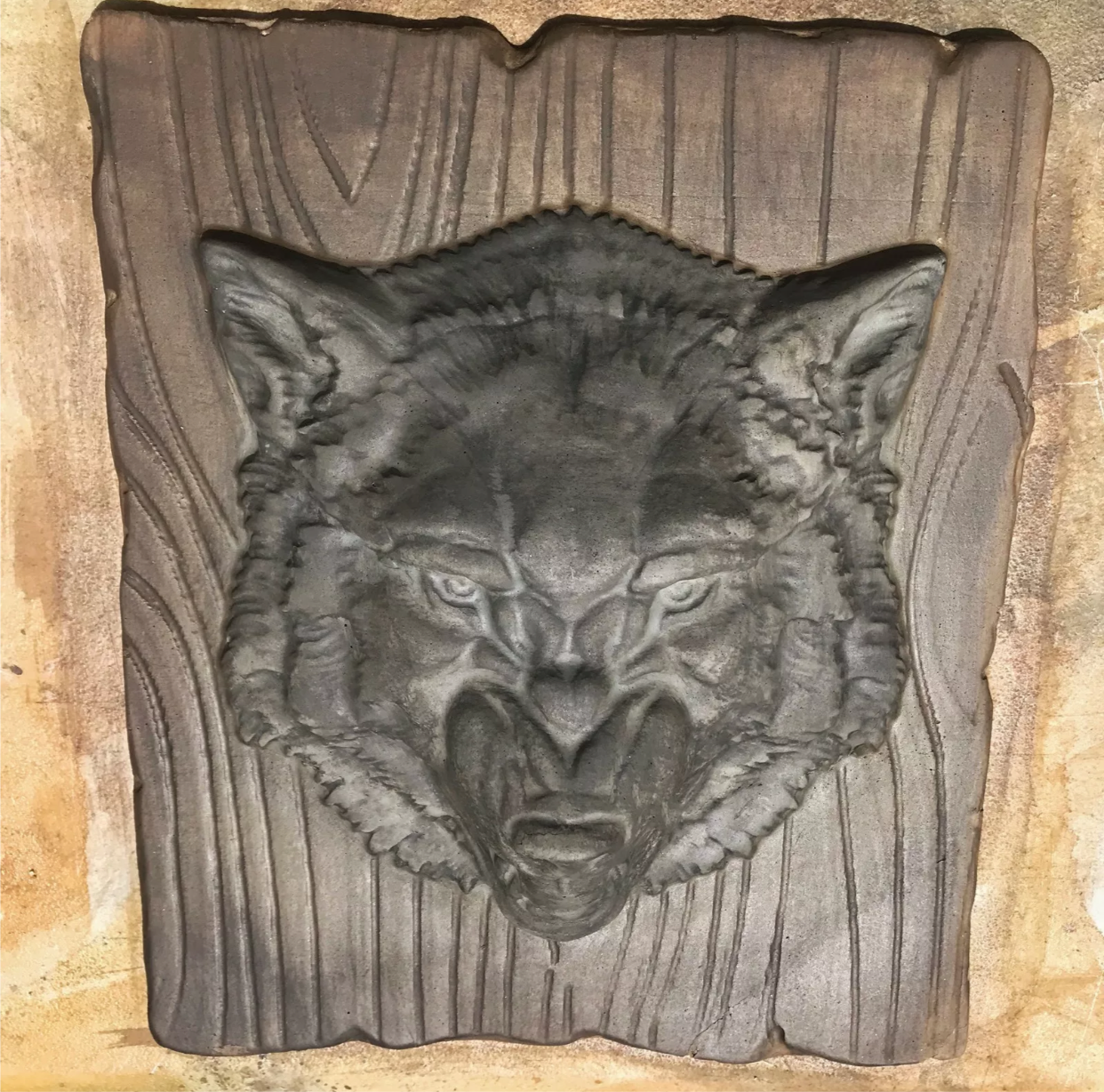 14-inch wolf head ABS casting mold by Pacific Mold Design showing dramatic wolf face with detailed fur texture for casting concrete and plaster indoor and outdoor wildlife wall art