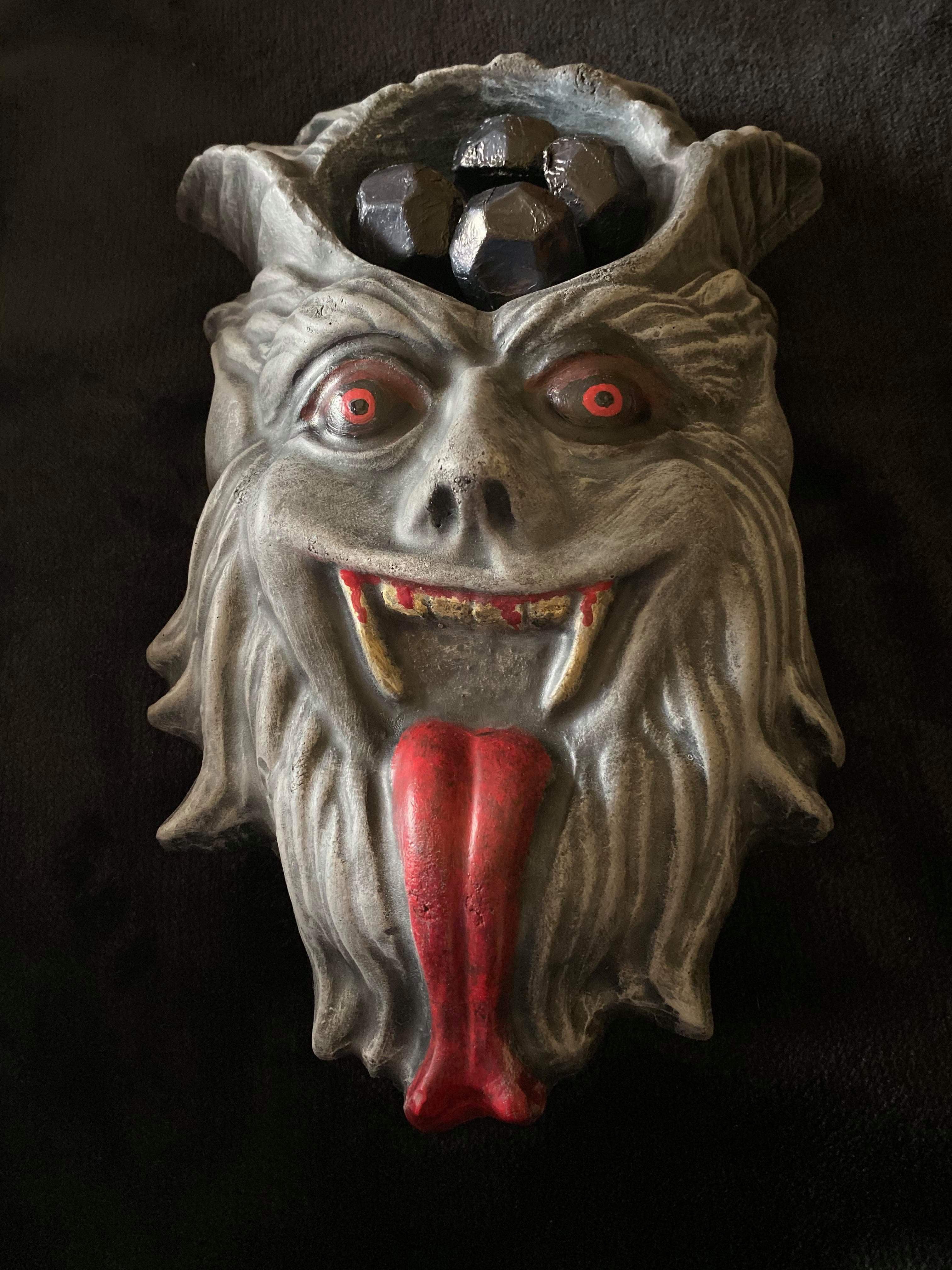 12-inch Krampus ABS casting mold by Pacific Mold Design showing detailed half-goat half-demon Krampus face with arched horns and slithering tongue for gothic Christmas concrete casting