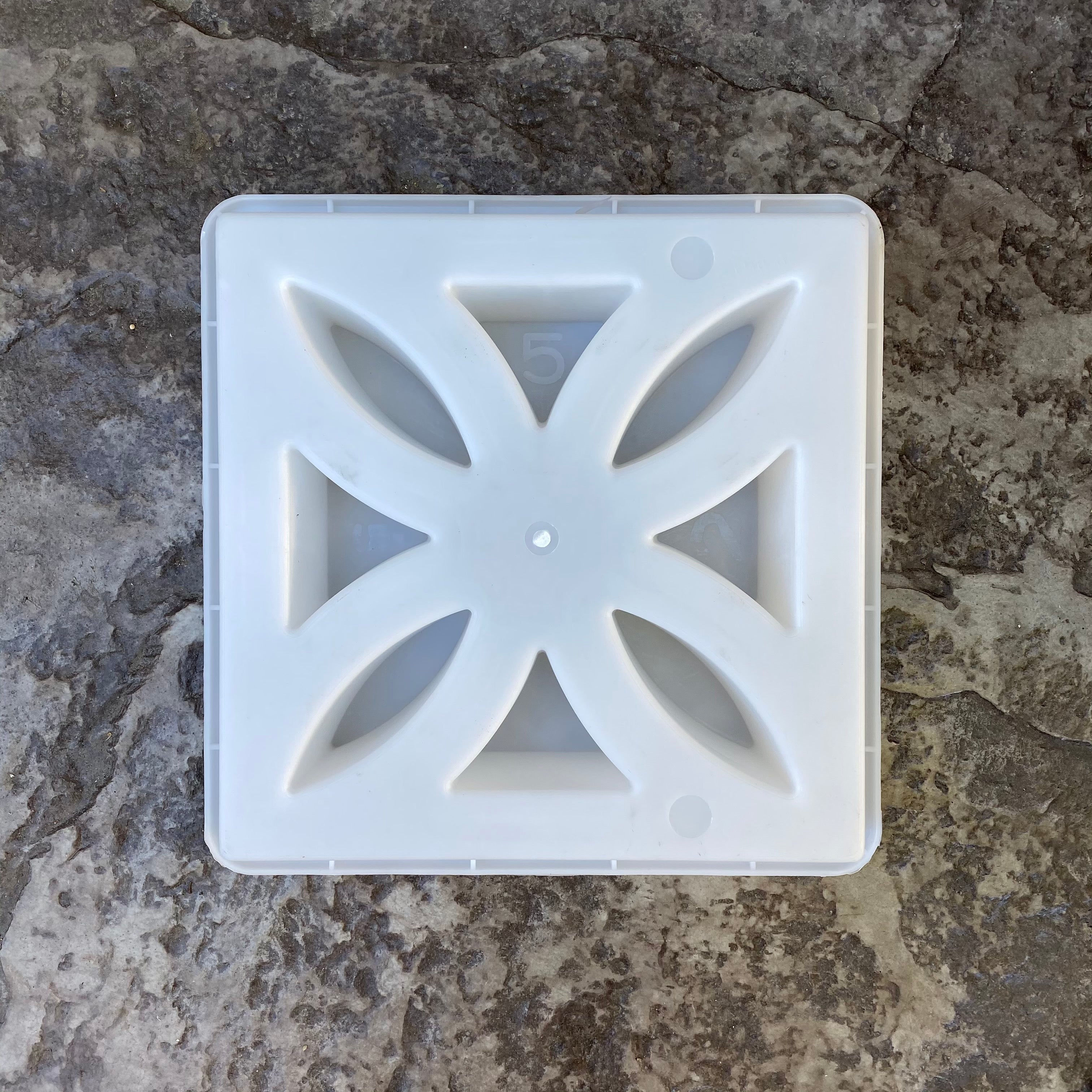 Sunflower breeze block mold by Pacific Mold Design showing cast white concrete block with vintage 1930s sunflower floral geometric pattern for retro decorative garden walls and patio privacy screens