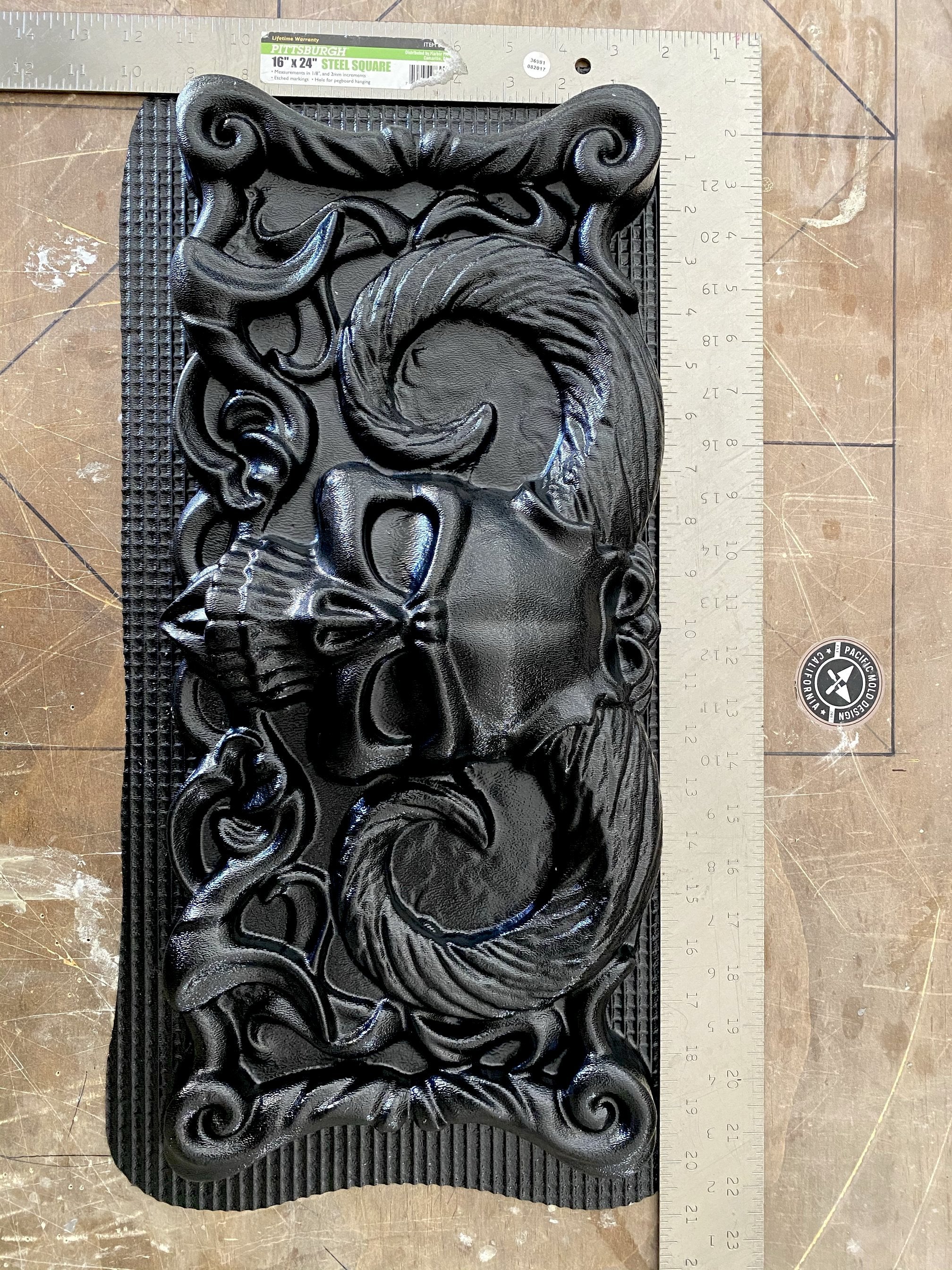 20-inch skull devil ABS casting mold by Pacific Mold Design showing large black plastic mold of menacing skull with devil horns designed for concrete and plaster casting