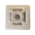 A beige-colored square-shaped product with a central circular depression and eight protruding vanes.