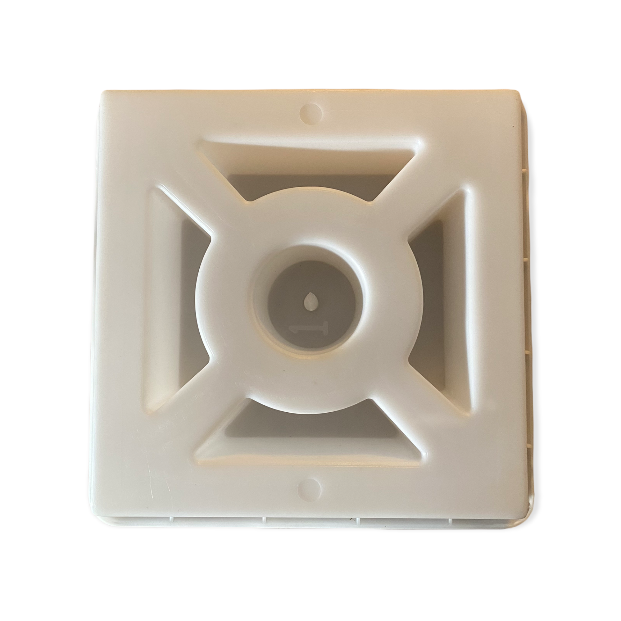 Zero breeze block mold by Pacific Mold Design showing cast beige concrete block with minimal geometric hub and vane pattern for clean modern mid-century decorative privacy walls