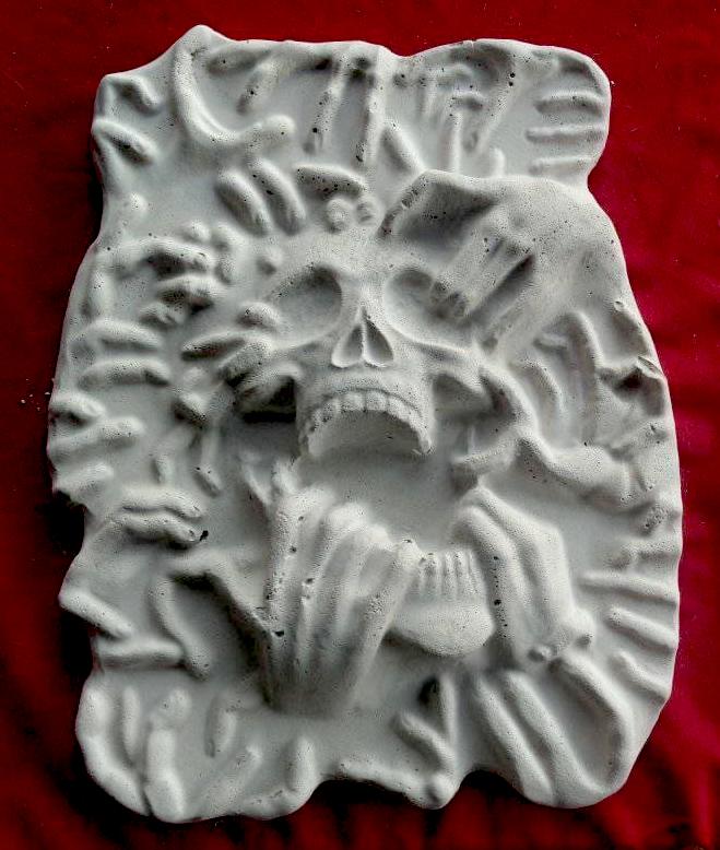 17-inch ripped skull ABS mold by Pacific Mold Design showing large plastic mold of skull being torn apart by hands on each side designed for concrete or plaster casting