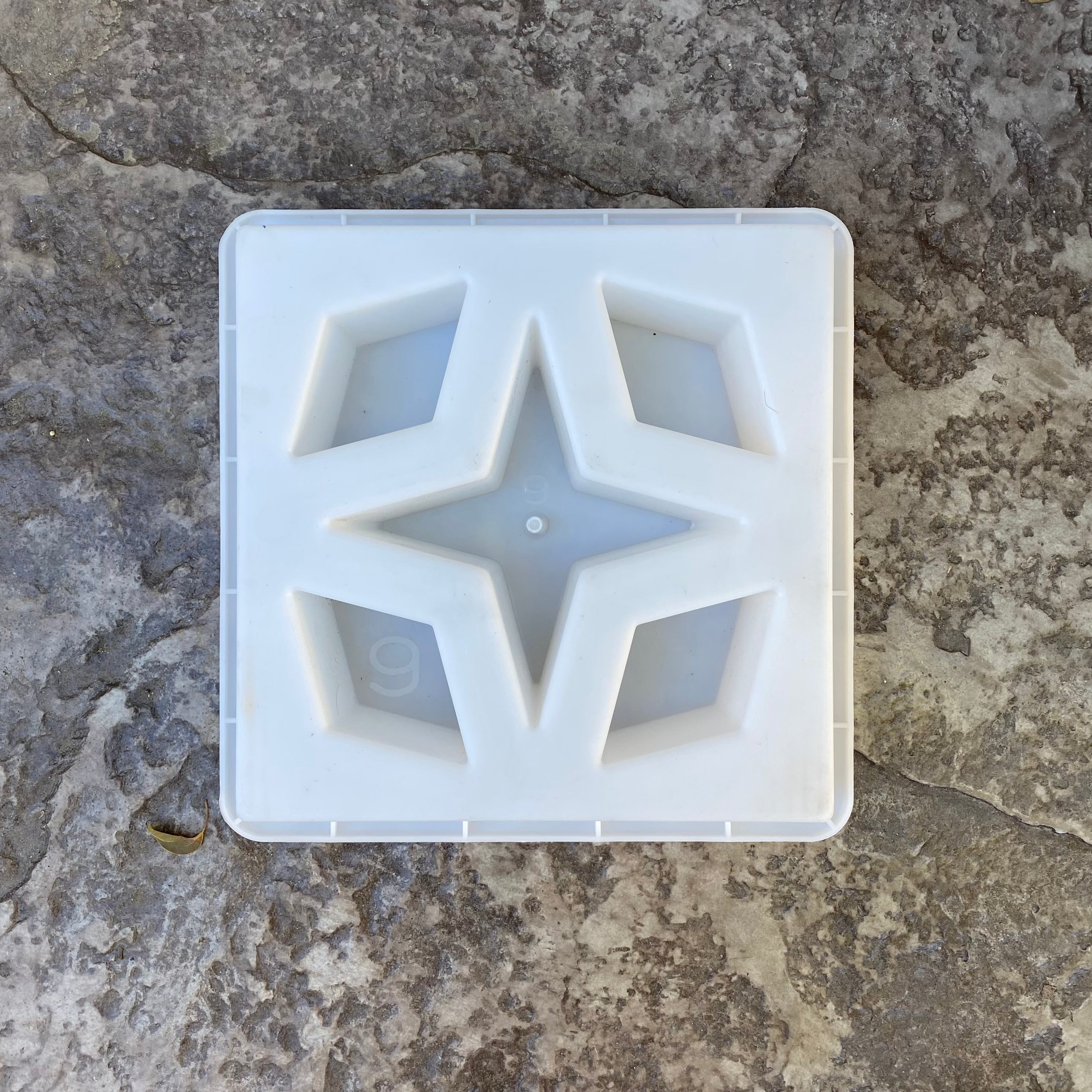 Constellation breeze block mold by Pacific Mold Design showing cast white concrete block with star constellation geometric pattern for decorative mid-century modern garden walls and architectural screens