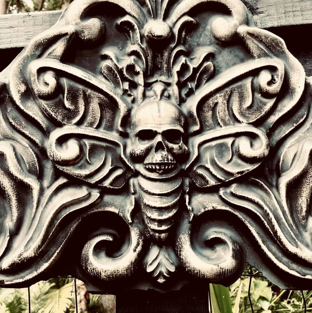 Death moth ABS mold by Pacific Mold Design showing large 28-inch black plastic mold of detailed moth with skull imagery and spread wings designed for concrete or plaster casting