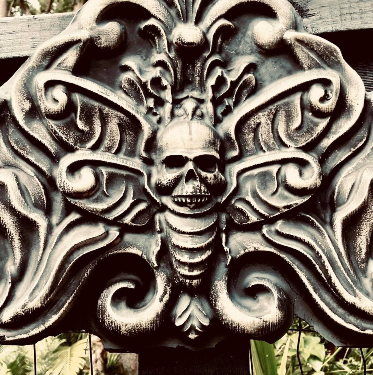 Death moth ABS mold by Pacific Mold Design showing large 28-inch black plastic mold of detailed moth with skull imagery and spread wings designed for concrete or plaster casting