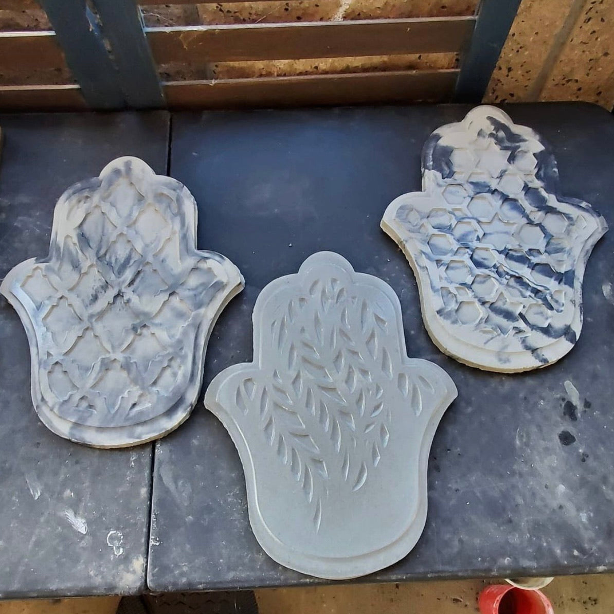 Hamsa hand ABS mold set by Pacific Mold Design showing 10-inch protective hand symbol mold in black plastic sold as set of three for casting concrete and plaster spiritual home and garden décor