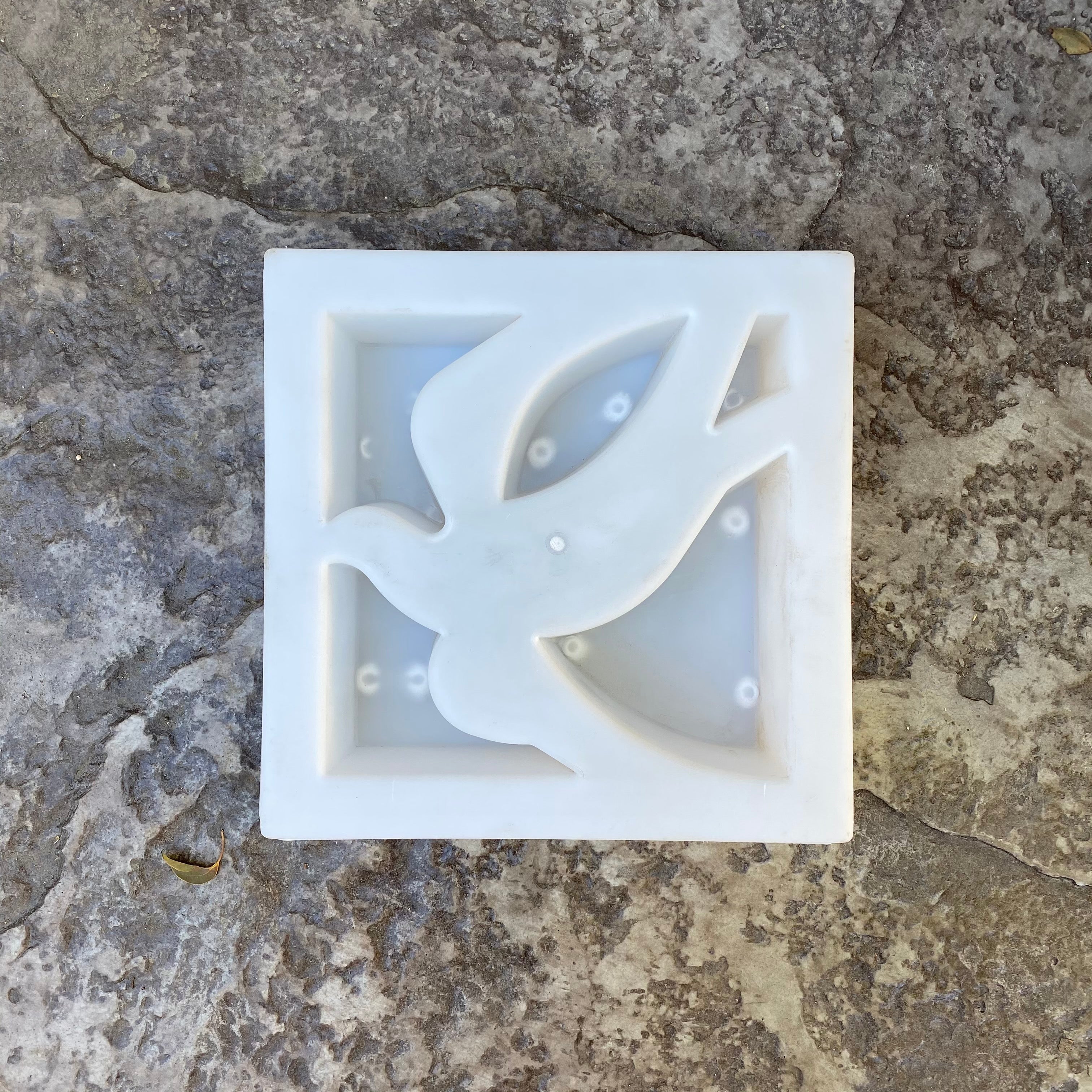 Swallow breeze block mold by Pacific Mold Design showing cast white concrete block with graceful swallow bird geometric pattern for nature-inspired decorative mid-century garden walls and patio screens