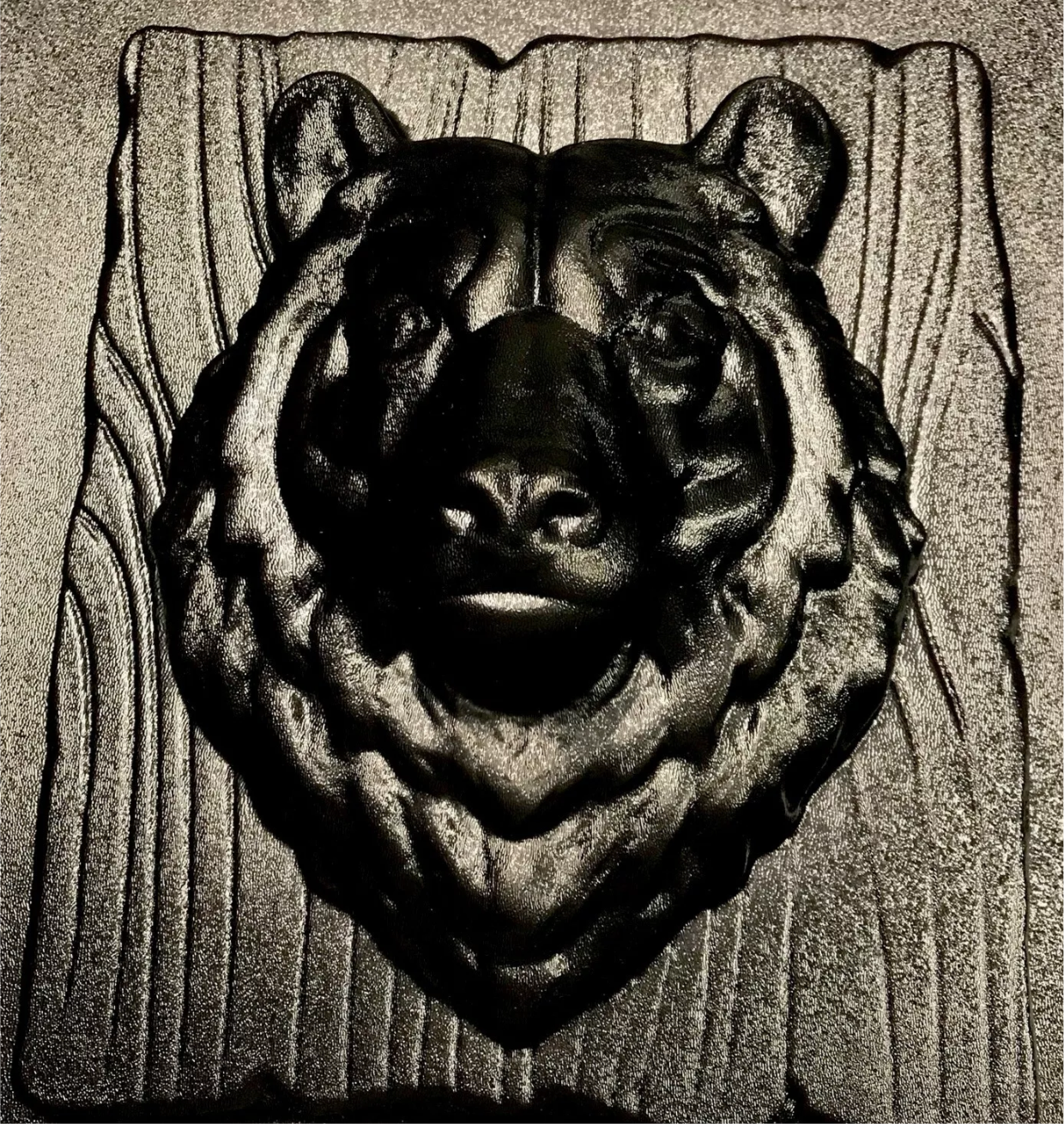 14-inch bear head ABS casting mold by Pacific Mold Design showing realistic bear face with 4-inch snout depth mounted on wood grain plank texture for concrete and plaster cabin and garden wall art