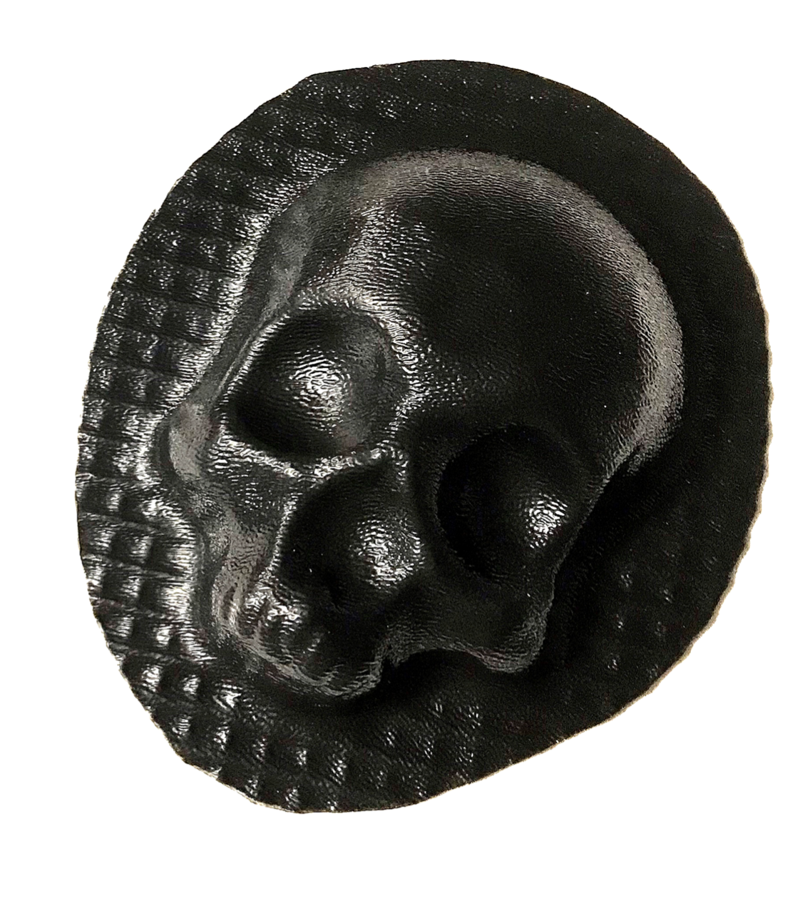 Set of white plaster skull castings arranged decoratively around a fireplace with black metal screen, showing finished results from Pacific Mold Design skull fireplace mold set