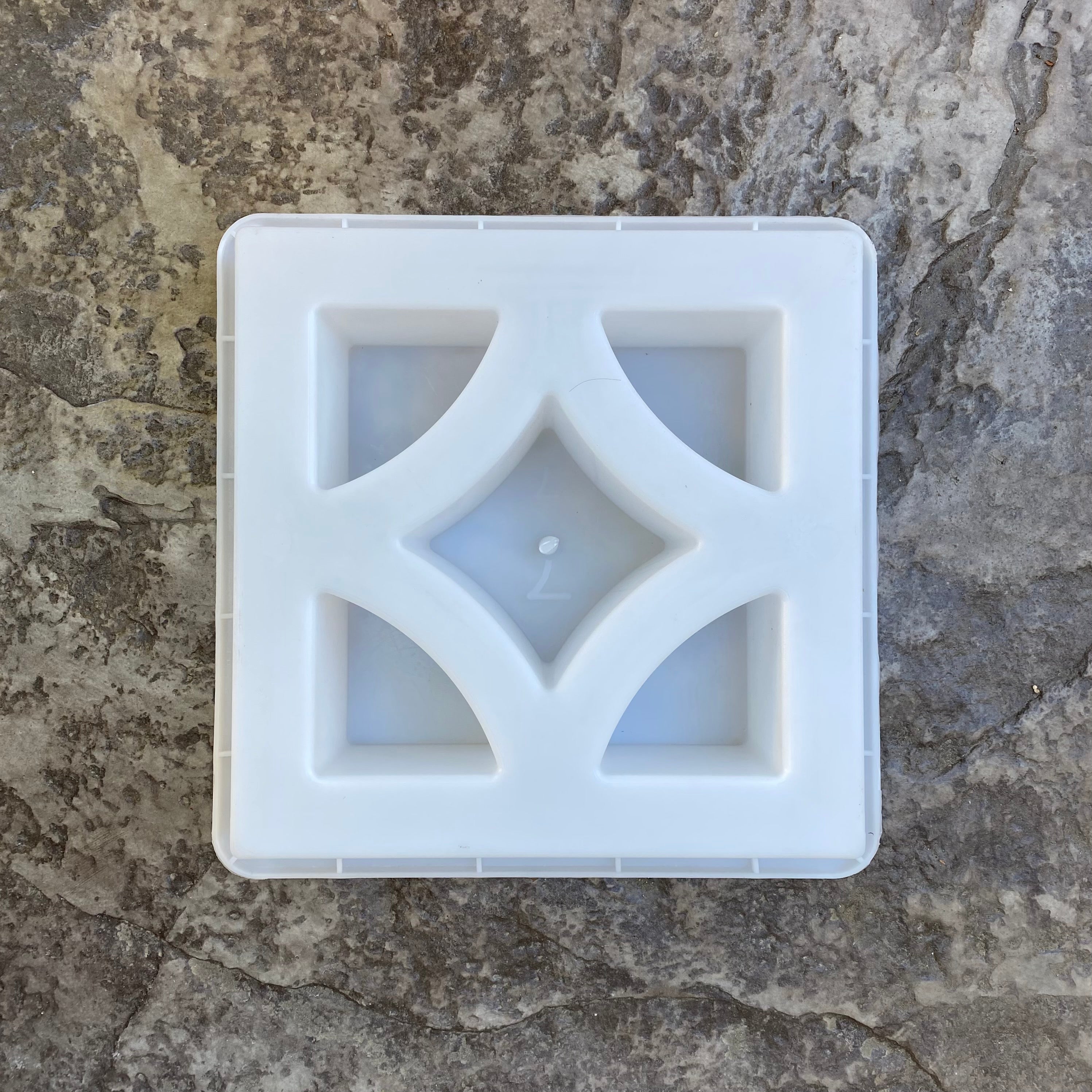 Empress breeze block mold by Pacific Mold Design showing cast concrete block with bold elegant diamond-inspired 1930s Art Deco geometric pattern for decorative architectural walls and courtyard screens