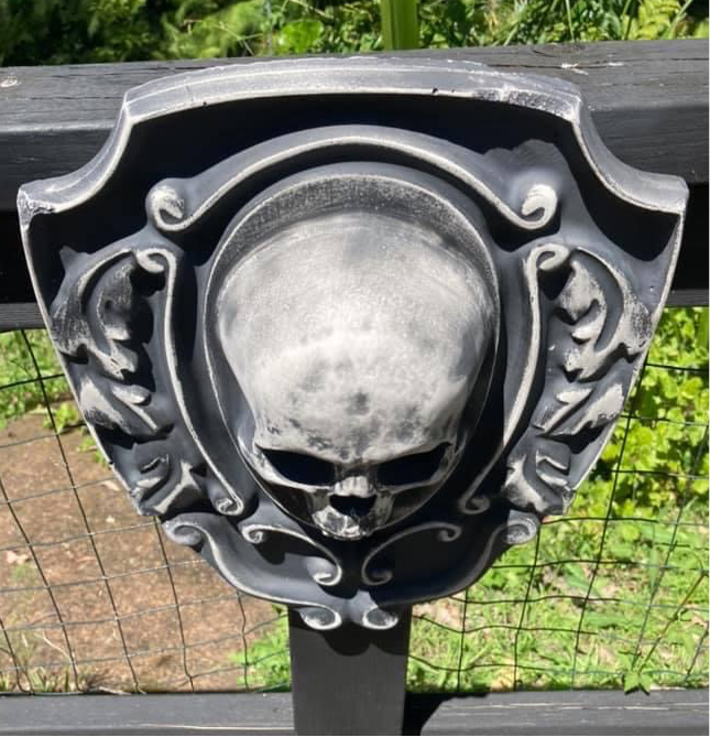 16-inch skull crest ABS mold by Pacific Mold Design showing gothic shield-style mold with skull centerpiece design measuring 16 by 14 inches for concrete and plaster casting