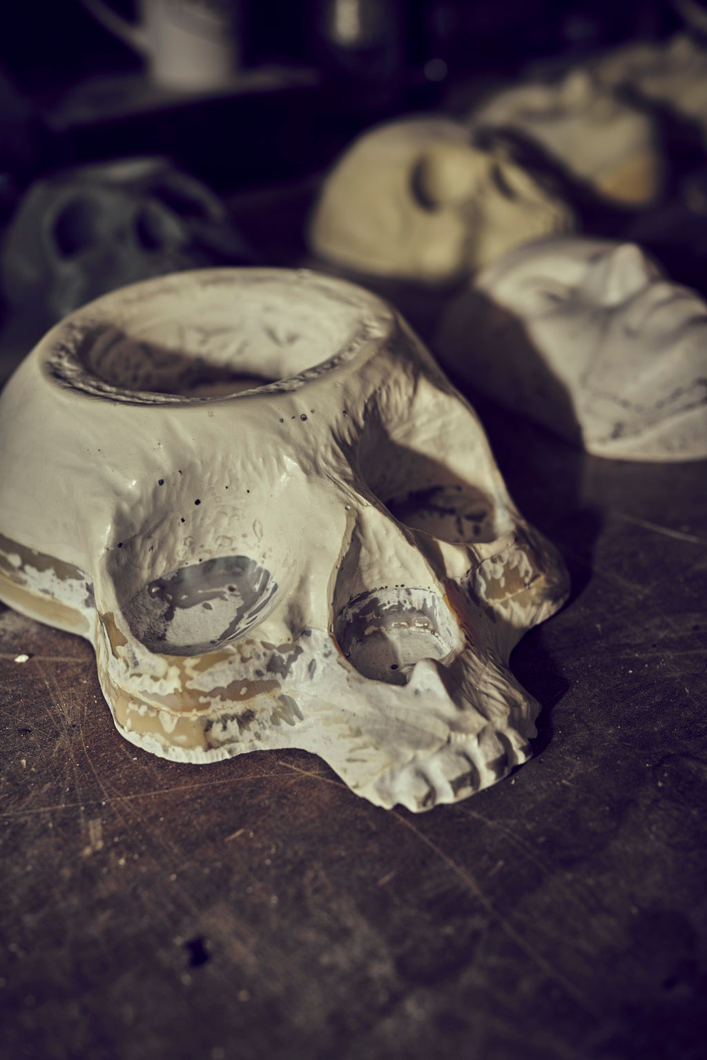 Four 11-inch skull planter ABS molds by Pacific Mold Design arranged together showing batch casting set for producing multiple concrete or plaster gothic skull planters