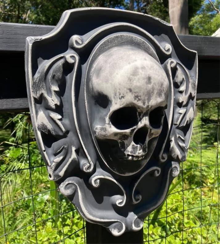 16-inch skull crest ABS mold by Pacific Mold Design showing gothic shield-style mold with skull centerpiece design measuring 16 by 14 inches for concrete and plaster casting