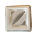 A beige-colored decorative block with an abstract design
