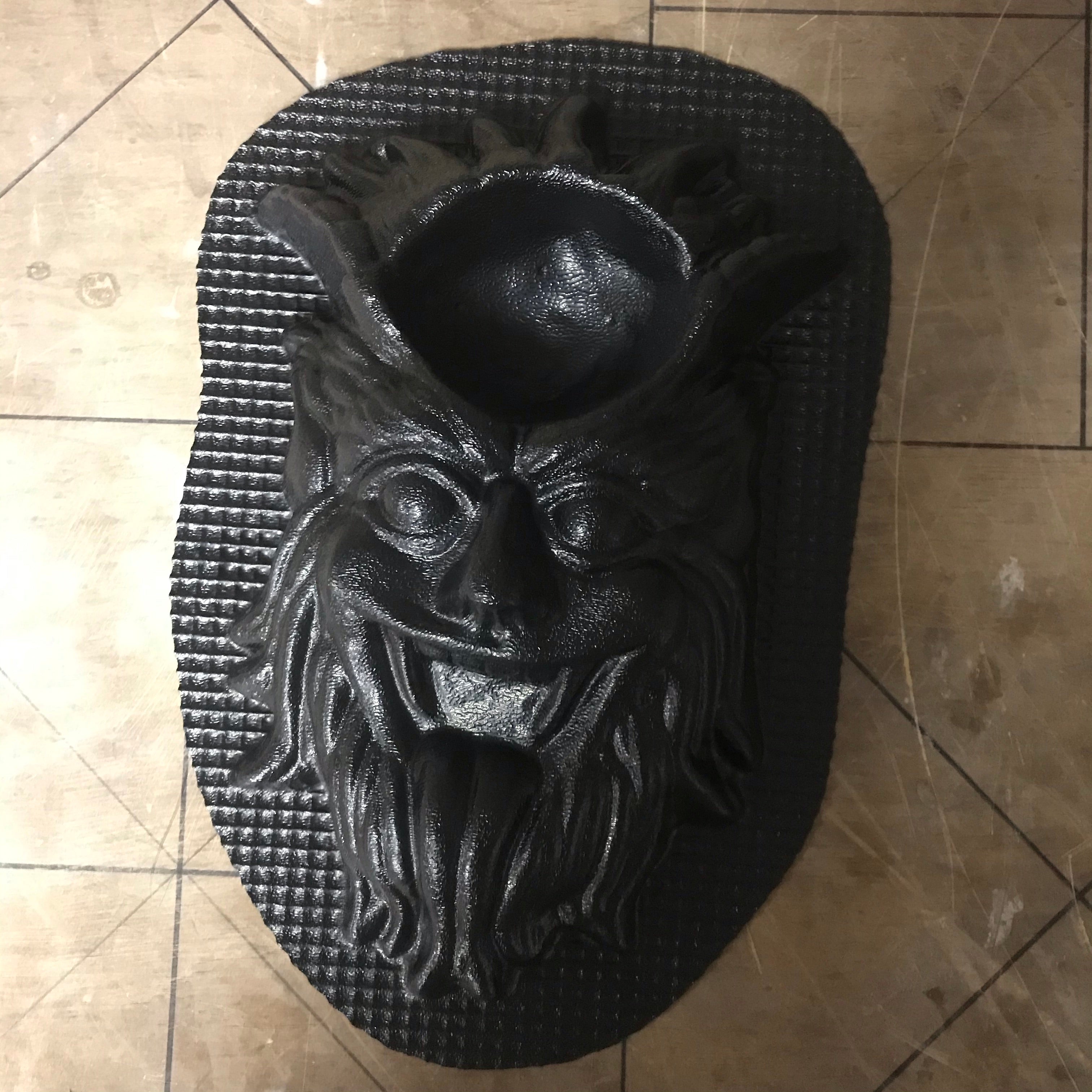 12-inch Krampus ABS casting mold by Pacific Mold Design showing detailed half-goat half-demon Krampus face with arched horns and slithering tongue for gothic Christmas concrete casting