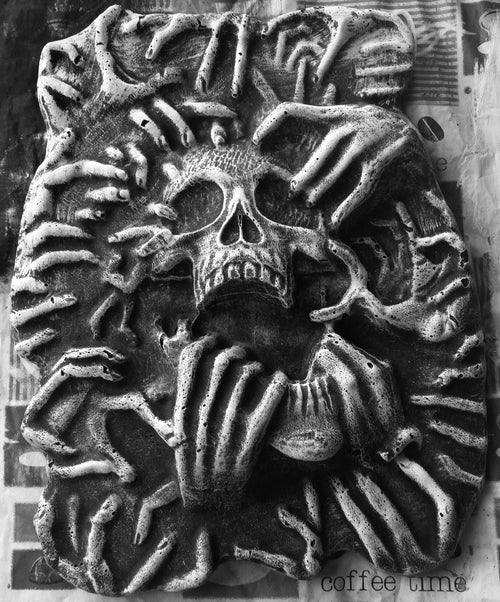 17-inch ripped skull ABS mold by Pacific Mold Design showing large plastic mold of skull being torn apart by hands on each side designed for concrete or plaster casting