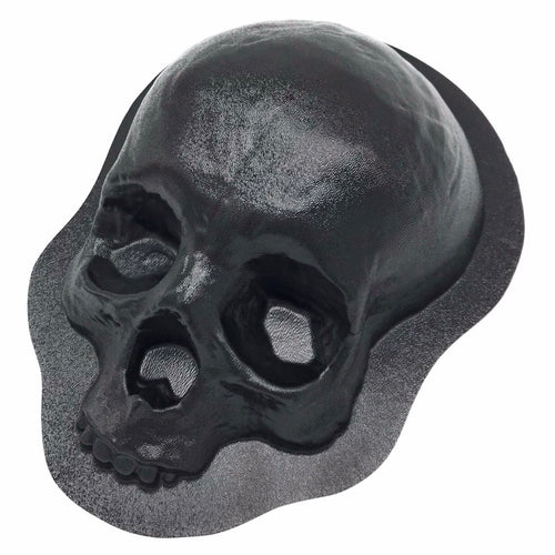 A black ABS plastic skull mold used for casting concrete or plaster.